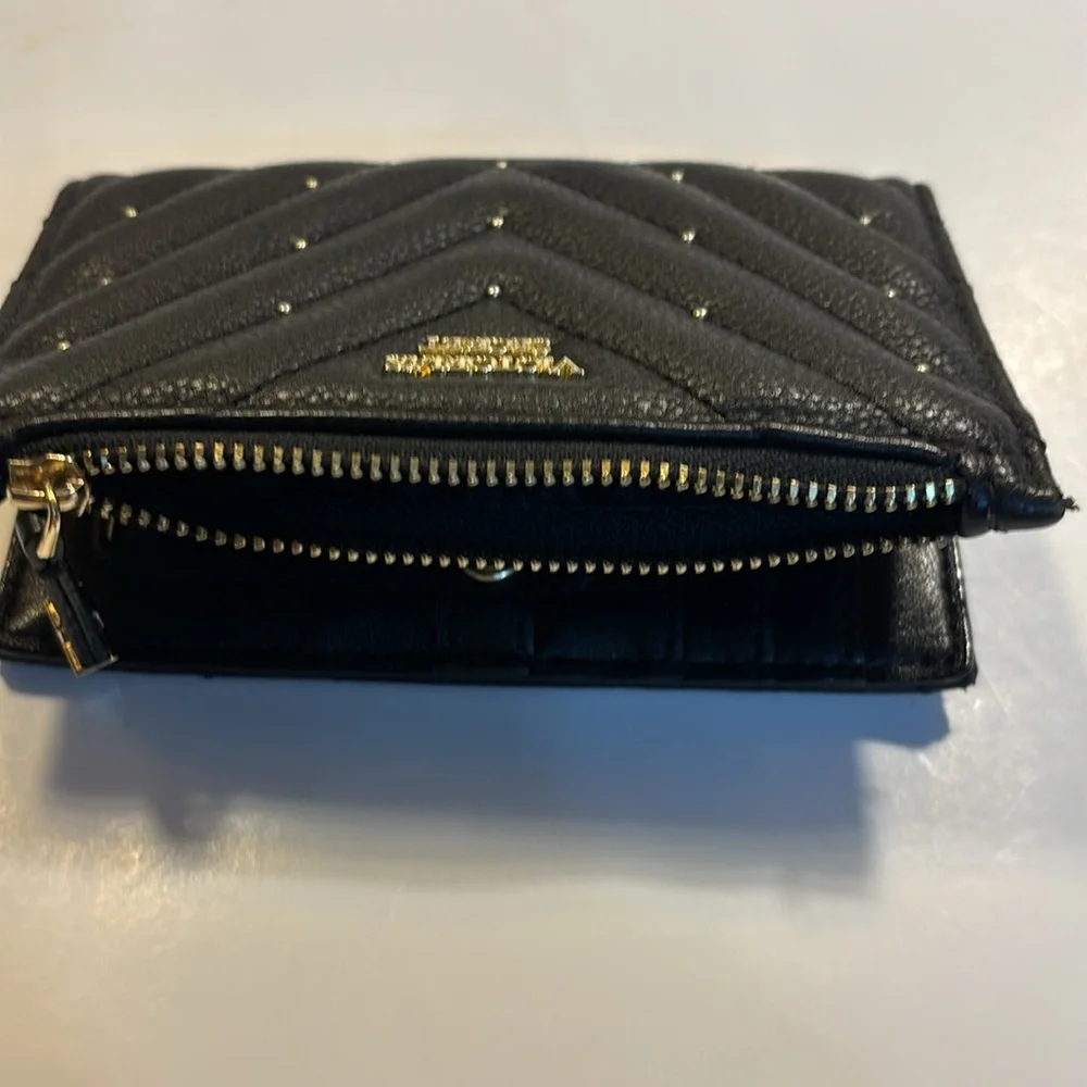 Victoria’s Secret small clutch/wallet black with gold color accents.